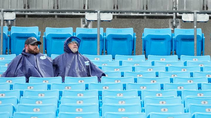 Dec 17, 2023; Charlotte, North Carolina, USA; Fans sit in the rain during warm ups before the game between the Carolina Panthers and the Atlanta Falcons at Bank of America Stadium. Mandatory Credit: Jim Dedmon-USA TODAY Sports Dec 17, 2023; Charlotte, North Carolina, USA; Fans sit in the rain during warm ups before the game between the Carolina Panthers and the Atlanta Falcons at Bank of America Stadium. Mandatory Credit: Jim Dedmon-USA TODAY Sports