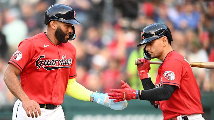 Jun 7, 2023; Cleveland, Ohio, USA; Cleveland Guardians shortstop Amed Rosario (1) celebrates after scoring with second baseman Andres Gimenez (0) during the fourth inning against the Boston Red Sox at Progressive Field. Mandatory Credit: Ken Blaze-Imagn Images