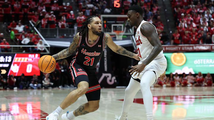 Houston Cougars guard Emanuel Sharp (21) drives to the basket against Utah Runnin' Utes forward Seydou Traore (0) during the first half at Jon M. Huntsman Center. 