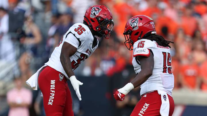 Aug 29, 2026; Charlottesville, Virginia, USA; North Carolina State Wolfpack linebacker LaCorian Hodge (35) celebrates a sack with linebacker AJ Richardson (15) during the second quarter of the game against the Virginia Cavaliers at Scott Stadium. Mandatory Credit: Greg Atkins-Imagn Images Aug 29, 2026; Charlottesville, Virginia, USA; North Carolina State Wolfpack linebacker LaCorian Hodge (35) celebrates a sack with linebacker AJ Richardson (15) during the second quarter of the game against the Virginia Cavaliers at Scott Stadium. Mandatory Credit: Greg Atkins-Imagn Images