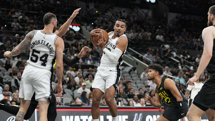 Oct 12, 2024; San Antonio, Texas, USA;  San Antonio Spurs guard Tre Jones (33) grabs a rebound in the first half against the Utah Jazz at Frost Bank Center. 