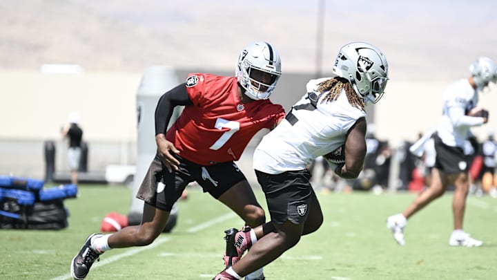 Jun 11, 2025; Henderson, NV, USA; Las Vegas Raiders quarterback Geno Smith (7) hands the ball to running back Ashton Jeanty (2) during Las Vegas Raiders Minicamp at Intermountain Health Performance Center. Mandatory Credit: Candice Ward-Imagn Images