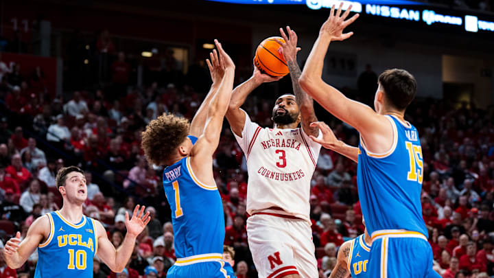 Jan 4, 2025; Lincoln, Nebraska, USA; Nebraska Cornhuskers guard Brice Williams (3) shoots the ball against UCLA Bruins guard Trent Perry (1) and center Aday Mara (15) during the first half at Pinnacle Bank Arena.