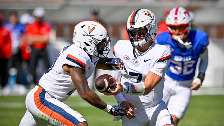 Oct 17, 2026; Dallas, Texas, USA; Virginia Cavaliers quarterback Beau Pribula (7) hands off the ball to running back Peyton Lewis (2) during the first half against the SMU Mustangs at Gerald J. Ford Stadium. Mandatory Credit: Jerome Miron-Imagn Images