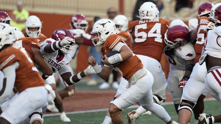Nov 22, 2025; Austin, Texas, USA; Texas Longhorns quarterback Arch Manning (16) keeps the ball and runs for a touchdown during the second half against the Arkansas Razorbacks at Darrell K Royal-Texas Memorial Stadium. Mandatory Credit: Scott Wachter-Imagn Images