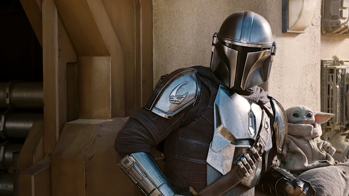 The Mandalorian (Pedro Pascal) and the Child in THE MANDALORIAN, season two, exclusively on Disney+