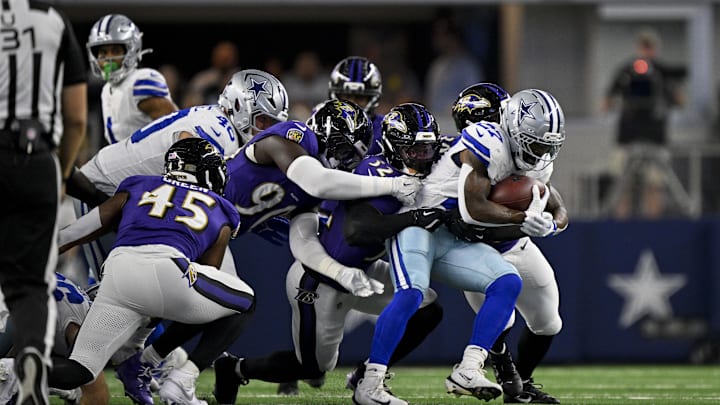 Aug 16, 2025; Arlington, Texas, USA; Dallas Cowboys running back Miles Sanders (27) is tackled by the Dallas Cowboys defense during the second quarter at AT&T Stadium. Mandatory Credit: Jerome Miron-Imagn Images Aug 16, 2025; Arlington, Texas, USA; Dallas Cowboys running back Miles Sanders (27) is tackled by the Dallas Cowboys defense during the second quarter at AT&T Stadium. Mandatory Credit: Jerome Miron-Imagn Images