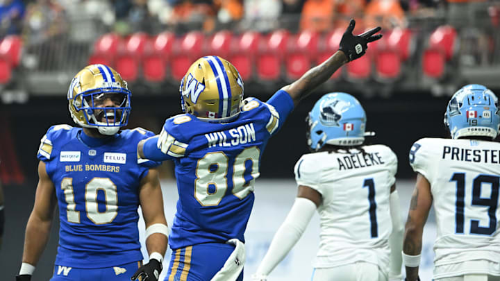 Nov 17, 2024; Vancouver, British Columbia, CAN; Winnipeg Blue Bombers wide receiver Ontaria Wilson (80) celebrates a play with wide receiver Nic Demski (10) against Toronto Argonauts during the second quarter at BC Place. Mandatory Credit: Simon Fearn-Imagn Images