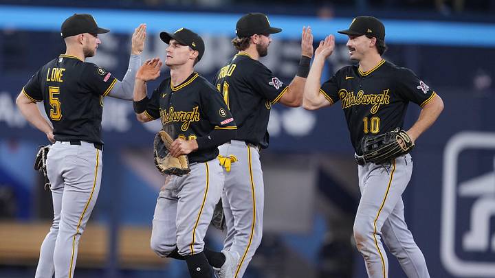 May 24, 2026; Toronto, Ontario, CAN; Pittsburgh Pirates left fielder Bryan Reynolds (10) celebrates the win with shortstop Jared Triolo (19) against the Toronto Blue Jays at the end of the ninth inning at Rogers Centre. Mandatory Credit: Nick Turchiaro-Imagn Images