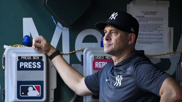 Aug 15, 2025; St. Louis, Missouri, USA;  New York Yankees manager Aaron Boone (17) looks on from the dugout before a game against the St. Louis Cardinals at Busch Stadium. Mandatory Credit: Jeff Curry-Imagn Images