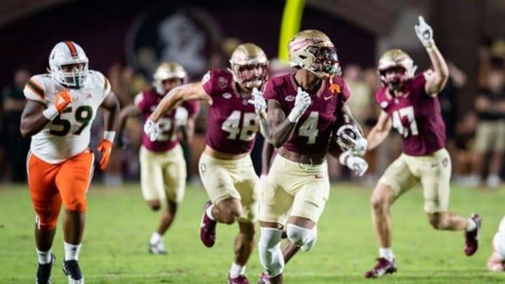 Seminoles wide receiver Keon Coleman sprints down the sideline in FSU's matchup with the Miami Hurricanes