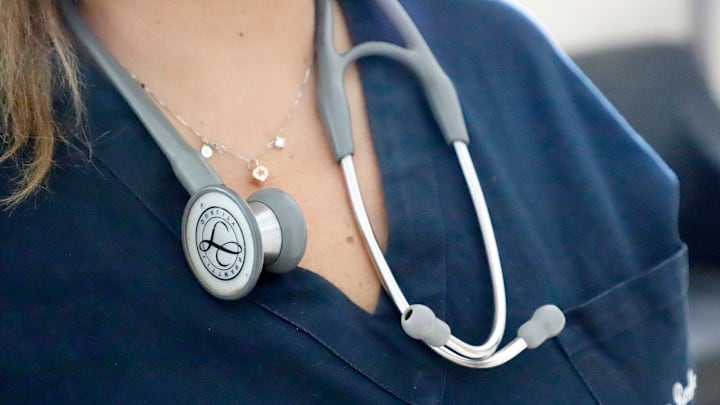 Doctor wearing stethoscope and necklace