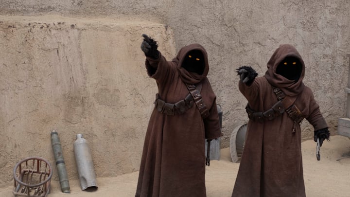 Jawas in a scene from Lucasfilm's THE BOOK OF BOBA FETT, exclusively on Disney+. © 2022 Lucasfilm Ltd. & ™. All Rights Reserved.