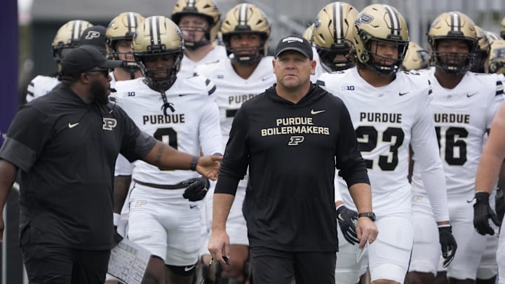Purdue Boilermakers head coach Barry Odom takes the field with his team