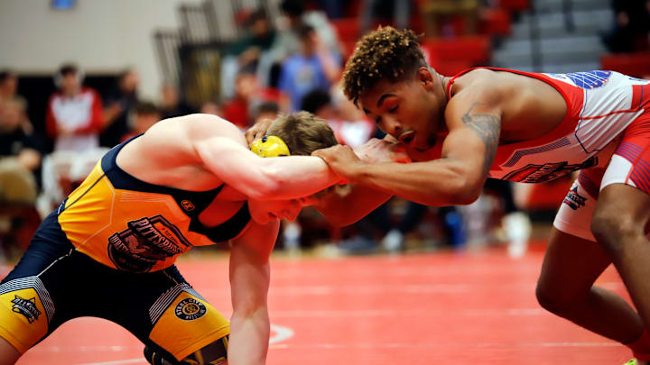 Oklahoma State commit LaDarion Lockett, ranked No. 1 at 172 pounds, looks for a window to score points against Bode Marlow Saturday during the Pittsburgh Wrestling Classic at Peters Township High School. Lockett won by technical fall to help the U.S. All-Stars win the event for the 12th straight year over the Pennsylvania team.