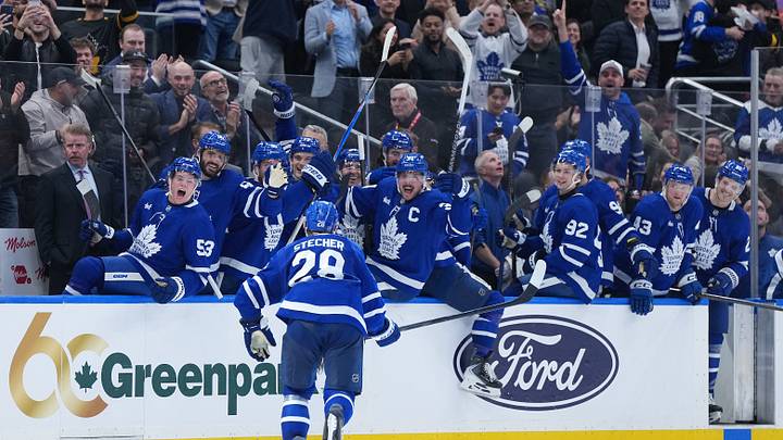 Oct 22, 2026; Toronto, Ontario, CAN;  Toronto Maple Leafs defenseman Troy Stecher (28) celebrates at the bench after scoring the winning goal against the New York Rangers during the third period at Scotiabank Arena.  Mandatory Credit: Nick Turchiaro-Imagn Images