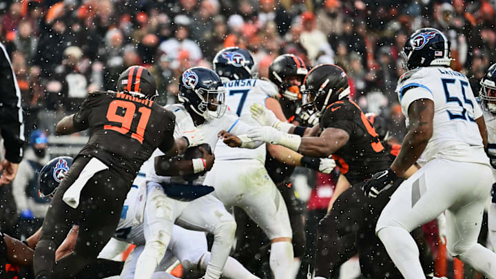 Dec 7, 2025; Cleveland, Ohio, USA; Cleveland Browns defensive end Myles Garrett (95) sacks Tennessee Titans quarterback Cam Ward (1) during the second quarter at Huntington Bank Field. Mandatory Credit: Ken Blaze-Imagn Images