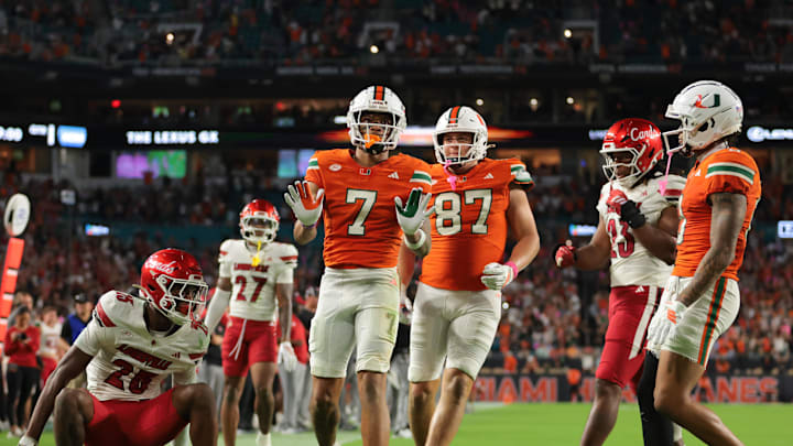 Oct 17, 2025; Miami Gardens, Florida, USA; Miami Hurricanes wide receiver CJ Daniels (7) celebrates after scoring on a two-point conversion against the Louisville Cardinals during the fourth quarter at Hard Rock Stadium. Mandatory Credit: Sam Navarro-Imagn Images Oct 17, 2025; Miami Gardens, Florida, USA; Miami Hurricanes wide receiver CJ Daniels (7) celebrates after scoring on a two-point conversion against the Louisville Cardinals during the fourth quarter at Hard Rock Stadium. Mandatory Credit: Sam Navarro-Imagn Images