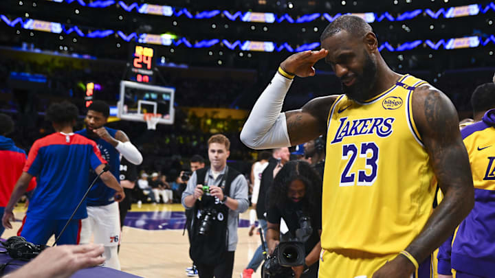 Nov 8, 2024; Los Angeles, California, USA; Los Angeles Lakers forward LeBron James (23) salutes before a game against the Philadelphia 76ers at Crypto.com Arena. Mandatory Credit: Jonathan Hui-Imagn Images