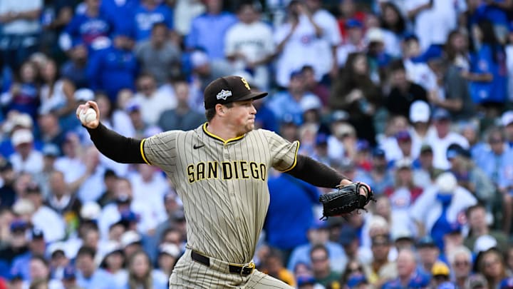 Oct 1, 2025; Chicago, Illinois, USA; San Diego Padres pitcher Mason Miller (22) delivers during the seventh inning against the Chicago Cubs during game two of the Wildcard round for the 2025 MLB playoffs at Wrigley Field. Mandatory Credit: Matt Marton-Imagn Images