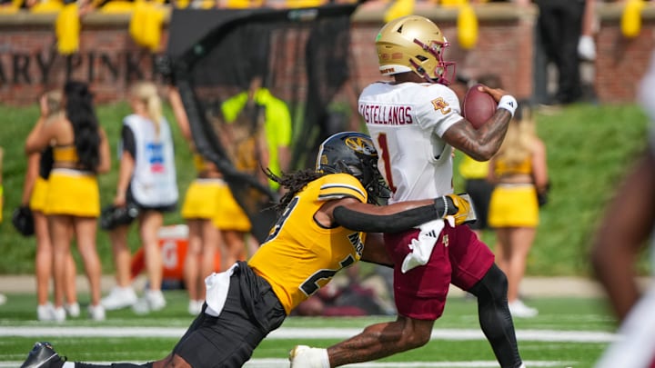 Sep 14, 2024; Columbia, Missouri, USA; Boston College Eagles quarterback Thomas Castellanos (1) runs the ball as Missouri Tigers linebacker Khalil Jacobs (29) makes the tackle during the second half at Faurot Field at Memorial Stadium. Mandatory Credit: Denny Medley-Imagn Images