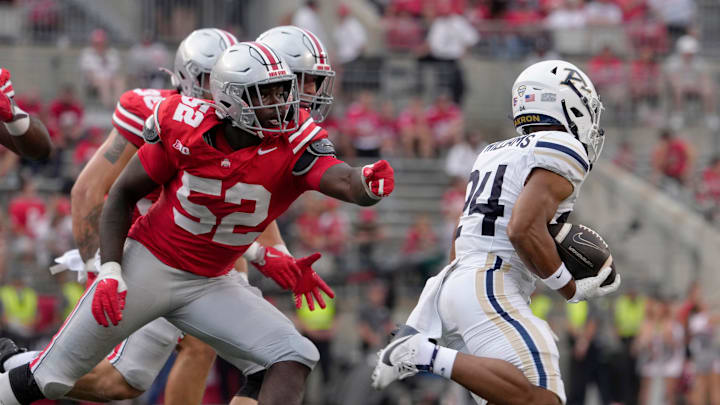 August 31, 2024; Columbus, Ohio, USA;
Akron Zips running back Marquese Williams (24) is pursued by Ohio State Buckeyes defensive end Joshua Mickens (52) during the second half of Saturday’s NCAA Division I football game at Ohio Stadium.