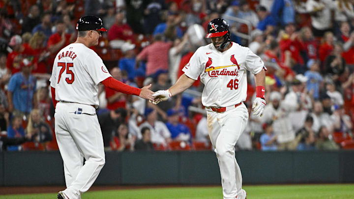 May 26, 2024; St. Louis, Missouri, USA;  St. Louis Cardinals first baseman Paul Goldschmidt (46) is congratulated by third base coach Ron 'Pop' Warner (75) after hitting a two run home run off against the Chicago Cubs during the fifth inning at Busch Stadium. Mandatory Credit: Jeff Curry-USA TODAY Sports