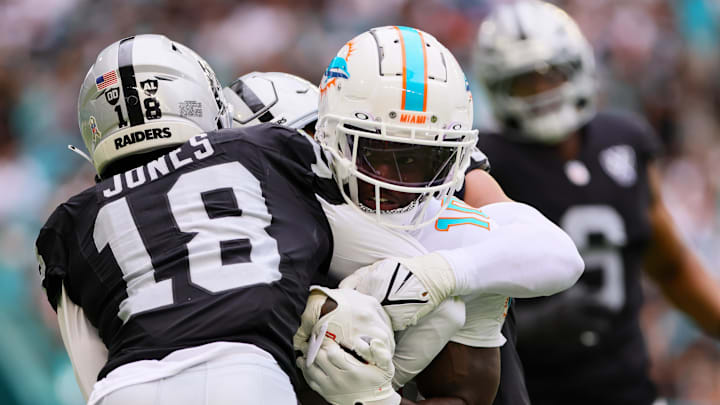 Miami Dolphins wide receiver Tyreek Hill (10) runs with the football against Las Vegas Raiders cornerback Jack Jones (18) during the third quarter at Hard Rock Stadium last season. Miami Dolphins wide receiver Tyreek Hill (10) runs with the football against Las Vegas Raiders cornerback Jack Jones (18) during the third quarter at Hard Rock Stadium last season.