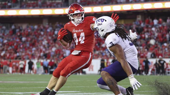 Nov 22, 2025; Houston, Texas, USA; Houston Cougars running back Dean Connors (44) runs past TCU Horned Frogs linebacker Kaleb Elarms-Orr (3) to score a touchdown during the third quarter at TDECU Stadium. Mandatory Credit: Troy Taormina-Imagn Images Nov 22, 2025; Houston, Texas, USA; Houston Cougars running back Dean Connors (44) runs past TCU Horned Frogs linebacker Kaleb Elarms-Orr (3) to score a touchdown during the third quarter at TDECU Stadium. Mandatory Credit: Troy Taormina-Imagn Images