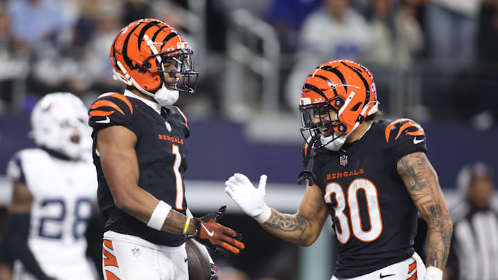 Dec 9, 2024; Arlington, Texas, USA;  Cincinnati Bengals wide receiver Ja'Marr Chase (1) and running back Chase Brown (30) celebrate a touchdown in the fourth quarter against the Dallas Cowboys at AT&T Stadium. Mandatory Credit: Tim Heitman-Imagn Images