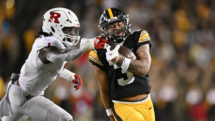 Nov 11, 2023; Iowa City, Iowa, USA; Iowa Hawkeyes wide receiver Kaleb Brown (3) gets yards after the catch as Rutgers Scarlet Knights lineback Mohamed Toure (1) reaches for the tackle during the fourth quarter at Kinnick Stadium. Mandatory Credit: Jeffrey Becker-Imagn Images Nov 11, 2023; Iowa City, Iowa, USA; Iowa Hawkeyes wide receiver Kaleb Brown (3) gets yards after the catch as Rutgers Scarlet Knights lineback Mohamed Toure (1) reaches for the tackle during the fourth quarter at Kinnick Stadium. Mandatory Credit: Jeffrey Becker-Imagn Images