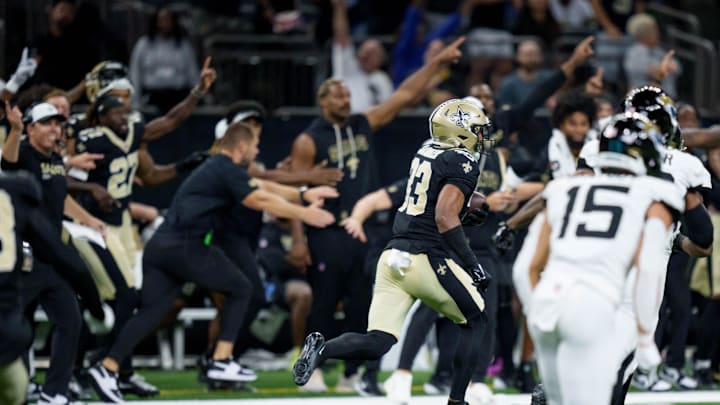 Aug 17, 2025; New Orleans, Louisiana, USA; New Orleans Saints safety Jonas Sanker (33) makes an interception against the Jacksonville Jaguars during the fourth quarter at Caesars Superdome. Mandatory Credit: Matthew Hinton-Imagn Images