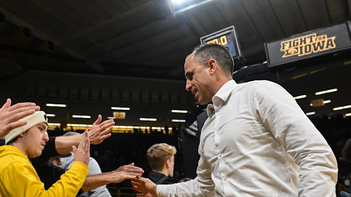 Dec 29, 2025; Iowa City, Iowa, USA; Iowa Hawkeyes head coach Ben McCollum greets fans after the game against the UMass Lowell River Hawks at Carver-Hawkeye Arena. Mandatory Credit: Jeffrey Becker-Imagn Images