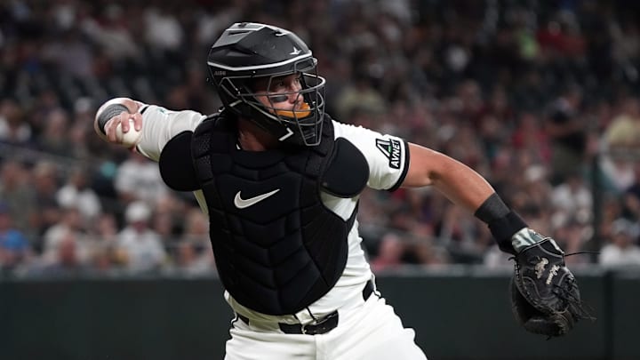 Aug 4, 2025; Phoenix, Arizona, USA; Arizona Diamondbacks catcher James McCann (8) throws against the San Diego Padres in the first inning at Chase Field. Mandatory Credit: Rick Scuteri-Imagn Images Aug 4, 2025; Phoenix, Arizona, USA; Arizona Diamondbacks catcher James McCann (8) throws against the San Diego Padres in the first inning at Chase Field. Mandatory Credit: Rick Scuteri-Imagn Images