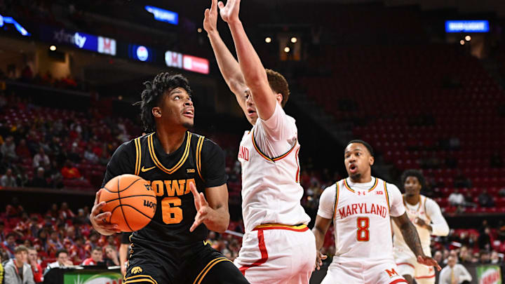 Feb 11, 2026; College Park, Maryland, USA;  Iowa Hawkeyes guard Tavion Banks (#6) looks for room to shoot under the basket in the first half against the Maryland Terrapins at Xfinity Center. Mandatory Credit: Jamie Sabau-Imagn Images