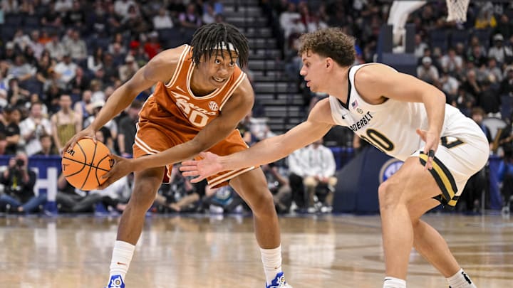 Mar 12, 2025; Nashville, TN, USA; Vanderbilt Commodores guard Chris Manon (30) guards Texas Longhorns guard Tre Johnson (20) during the second half at Bridgestone Arena. Mandatory Credit: Steve Roberts-Imagn Images Mar 12, 2025; Nashville, TN, USA; Vanderbilt Commodores guard Chris Manon (30) guards Texas Longhorns guard Tre Johnson (20) during the second half at Bridgestone Arena. Mandatory Credit: Steve Roberts-Imagn Images