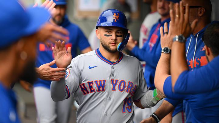 Jun 3, 2026; Seattle, Washington, USA; New York Mets shortstop Bo Bichette (19) celebrates in the dugout after scoring a run against the Seattle Mariners during the first inning at T-Mobile Park. Mandatory Credit: Steven Bisig-Imagn Images