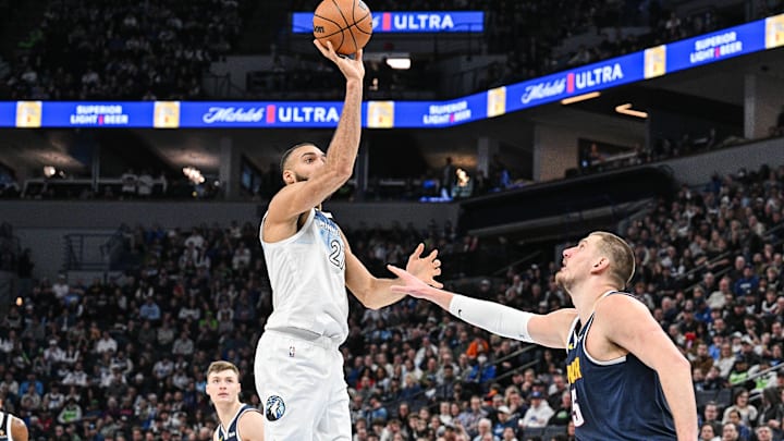 Minnesota Timberwolves center Rudy Gobert shoots the ball over Denver Nuggets center Nikola Jokic during the third quarter at Target Center in Minneapolis on Jan. 25, 2025.