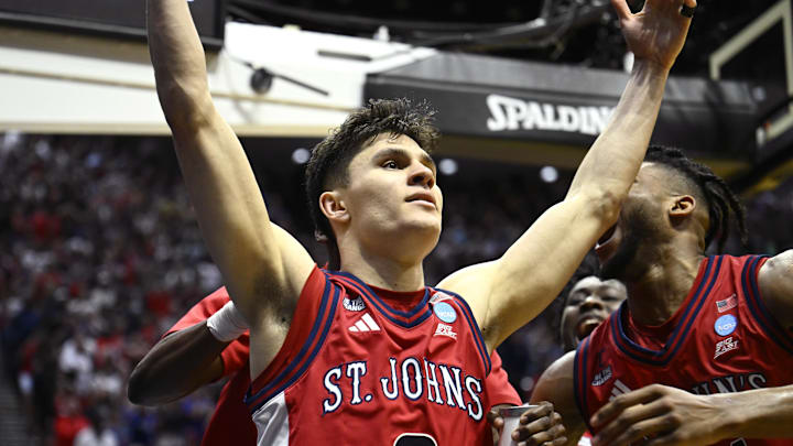 Mar 22, 2026; San Diego, CA, USA; St. John's basketball guard Dylan Darling (0) celebrates after defeating the Kansas Jayhawks in a second round game of the men's 2026 NCAA Tournament at Viejas Arena.