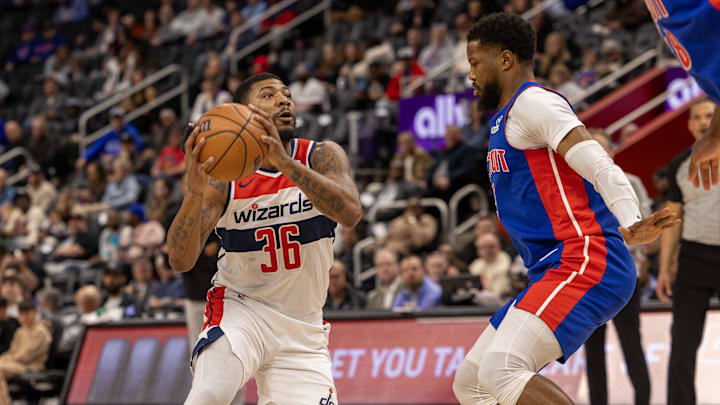 Mar 11, 2025; Detroit, Michigan, USA; Washington Wizards guard Marcus Smart (36) drives to the basket as Detroit Pistons guard Malik Beasley (5) defends during the first half at Little Caesars Arena. Mandatory Credit: David Reginek-Imagn Images