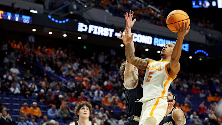 Mar 20, 2025; Lexington, KY, USA; Tennessee Volunteers guard Zakai Zeigler (5) shoots the ball against Wofford Terriers guard Corey Tripp (10) during the first half in the first round of the NCAA Tournament at Rupp Arena. Mandatory Credit: Jordan Prather-Imagn Images Mar 20, 2025; Lexington, KY, USA; Tennessee Volunteers guard Zakai Zeigler (5) shoots the ball against Wofford Terriers guard Corey Tripp (10) during the first half in the first round of the NCAA Tournament at Rupp Arena. Mandatory Credit: Jordan Prather-Imagn Images