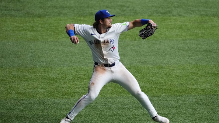 Jul 19, 2025; Toronto, Ontario, CAN; Toronto Blue Jays right fielder Addison Barger (47) throws a ball into the infield after catcheing a fly ball hit by San Francisco Giants left fielder Heliot Ramos (not pictured)during the sixth inning at Rogers Centre. Mandatory Credit: John E. Sokolowski-Imagn Images
