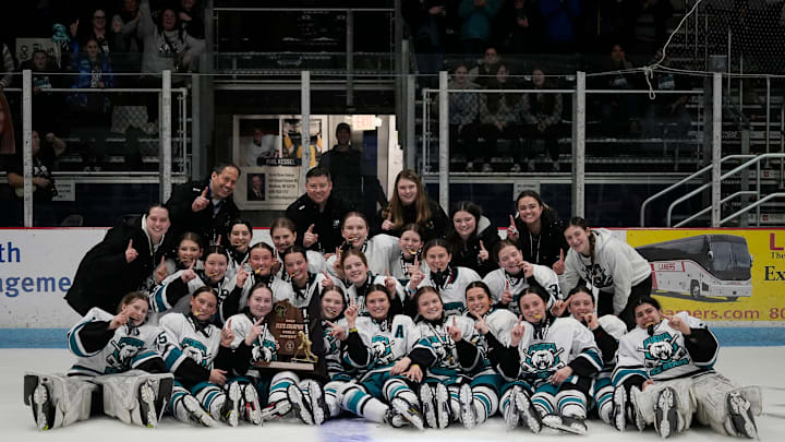 De Pere Co-op Bay Area Ice Bears pose with the 2025 WIAA State Girls Hockey Championship trophy after defeating the D.C. Everest Co-op on Saturday March 8, 2025 at the Bob Suter's Legacy20 Arena in Middleton, Wis.