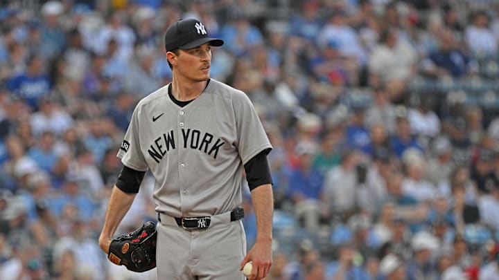 Jun 10, 2025; Kansas City, Missouri, USA;  New York Yankees starting pitcher Max Fried (54) looks down field in the first inning against the Kansas City Royals at Kauffman Stadium. Mandatory Credit: Peter Aiken-Imagn Images