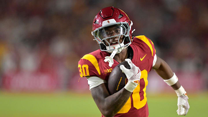 Sep 6, 2025; Los Angeles, California, USA; USC Trojans running back King Miller (30) carries the ball down the field for a touchdown in the second half against the Georgia Southern Eagles at the Los Angeles Memorial Coliseum. Mandatory Credit: Jayne Kamin-Oncea-Imagn Images Sep 6, 2025; Los Angeles, California, USA; USC Trojans running back King Miller (30) carries the ball down the field for a touchdown in the second half against the Georgia Southern Eagles at the Los Angeles Memorial Coliseum. Mandatory Credit: Jayne Kamin-Oncea-Imagn Images