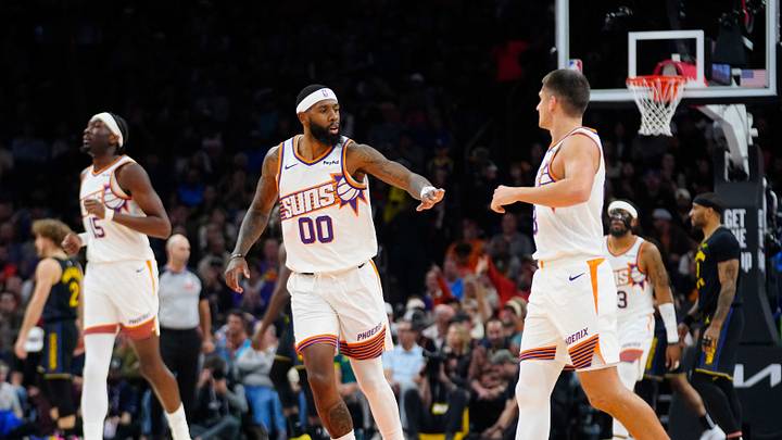 Suns guards Royce O’Neale (00) and Grayson Allen (8) high-five after a scoring run Suns guards Royce O’Neale (00) and Grayson Allen (8) high-five after a scoring run