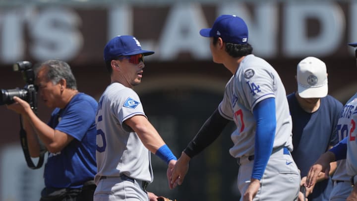 Jul 12, 2025; San Francisco, California, USA; Los Angeles Dodgers third baseman Tommy Edman (center left) and starting pitcher Shohei Ohtani (center right) celebrate after defeating the San Francisco Giants at Oracle Park. Mandatory Credit: Darren Yamashita-Imagn Images
