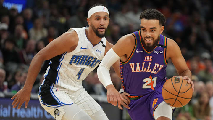 Phoenix Suns guard Tyus Jones drives on Orlando Magic guard Jalen Suggs. Phoenix Suns guard Tyus Jones drives on Orlando Magic guard Jalen Suggs.
