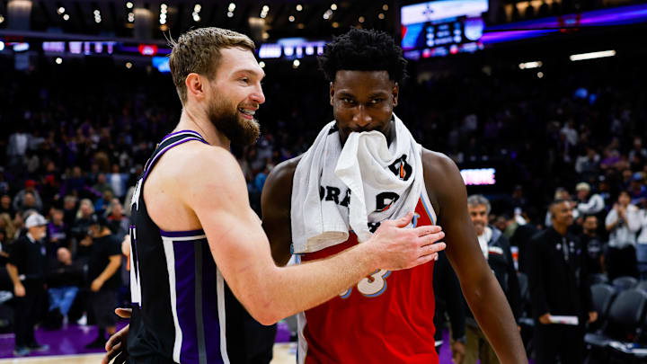Jan 3, 2025; Sacramento, California, USA; Sacramento Kings forward Domantas Sabonis (11) and Memphis Grizzlies forward Jaren Jackson Jr. (13) meet up after the game at Golden 1 Center. Mandatory Credit: Sergio Estrada-Imagn Images