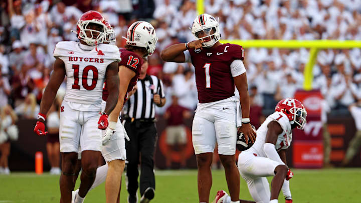 Sep 21, 2024; Blacksburg, Virginia, USA; Virginia Tech Hokies quarterback Kyron Drones (1) celebrates after getting a first down during the fourth quarter against the Rutgers Scarlet Knights at Lane Stadium. Mandatory Credit: Peter Casey-Imagn Images